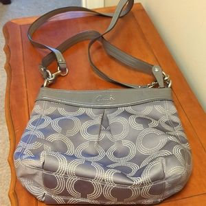 Coach crossbody purse with two different straps.